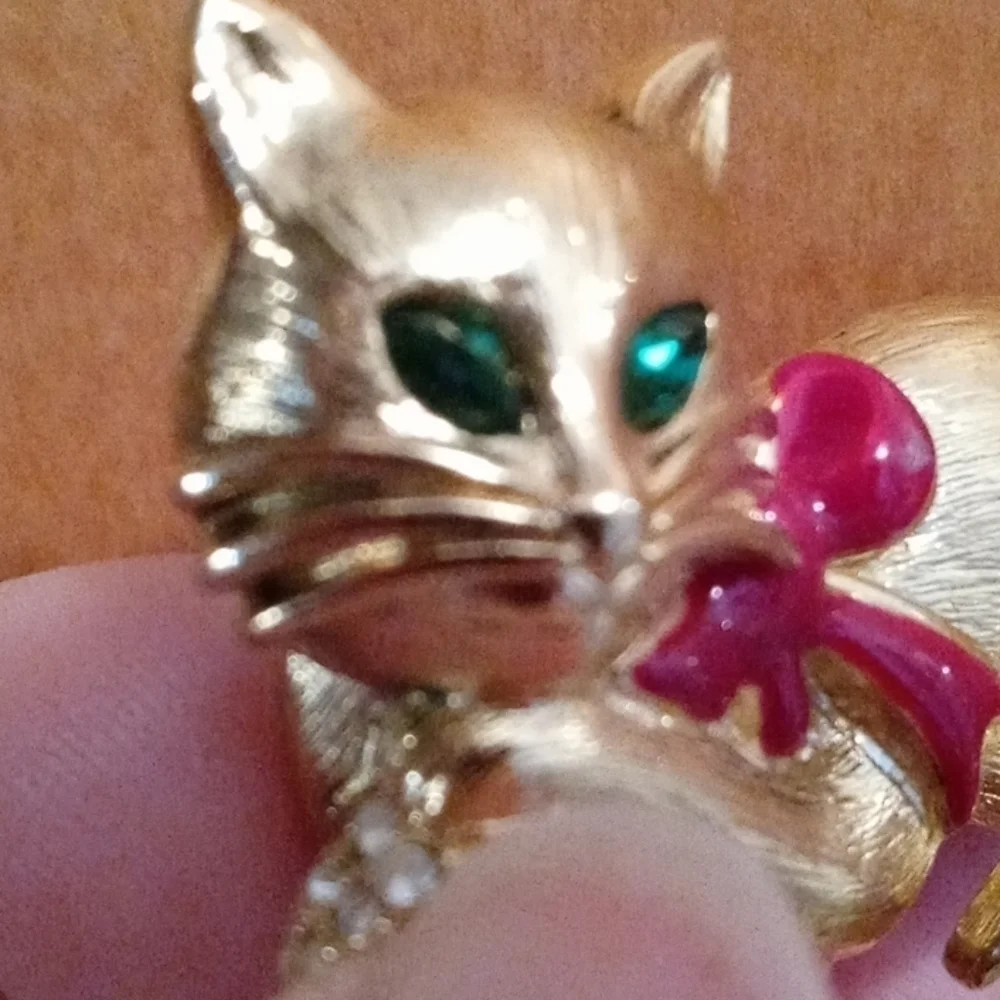 Napier cat brooch with emerald green jewel eyes and crystal stone ball